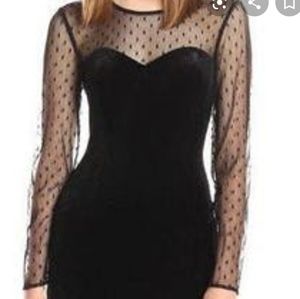 Bodycon dress with long mesh sleeves.